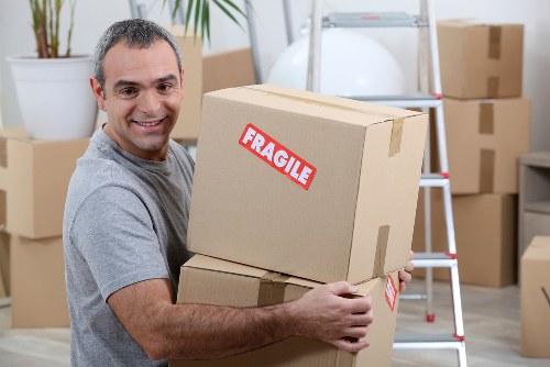 Storage pricing consultation with boxes and furniture ready for removal
