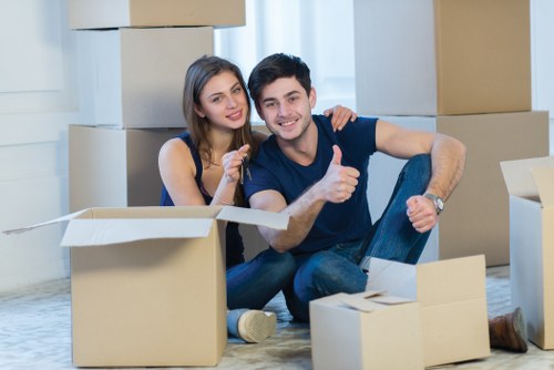 Packed moving boxes and furniture prepared for storage in Shadwell