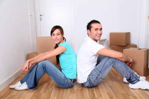 Removal team handling household items during a move in Shadwell