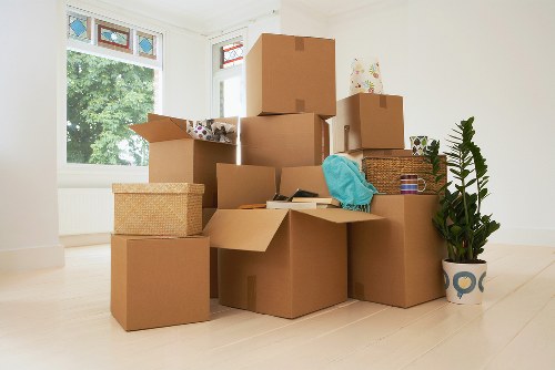 Packed boxes and furniture prepared for temporary storage in Shadwell